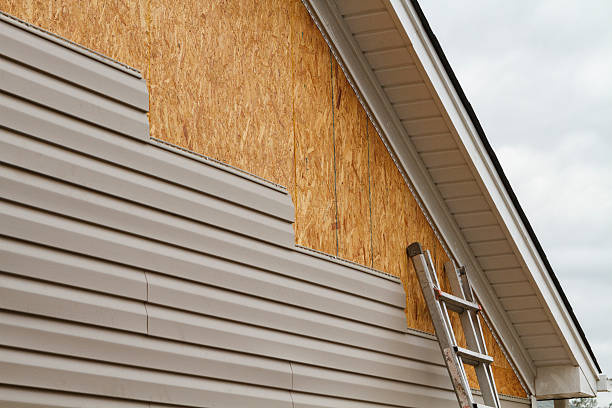 Professional Storm Damage Siding Repair technician working in Firestone, CO